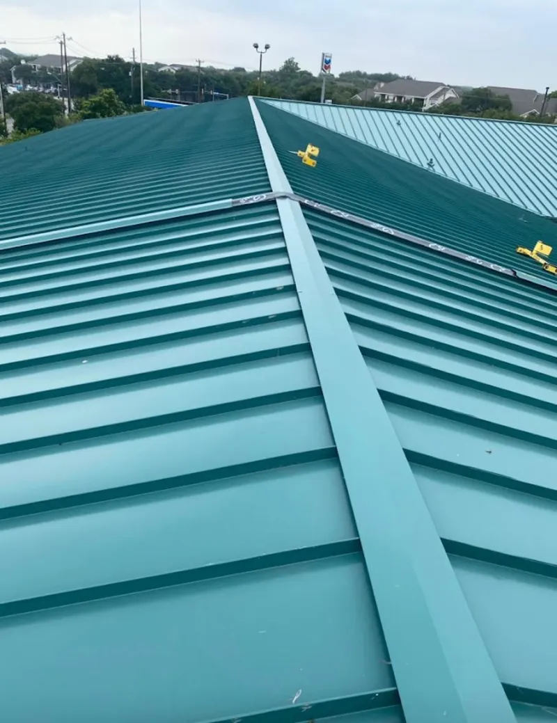 Green commercial metal roof ridge and valley for Metal Roof Repair in White Knoll